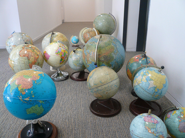 Picture of several world globes sitting on the floor