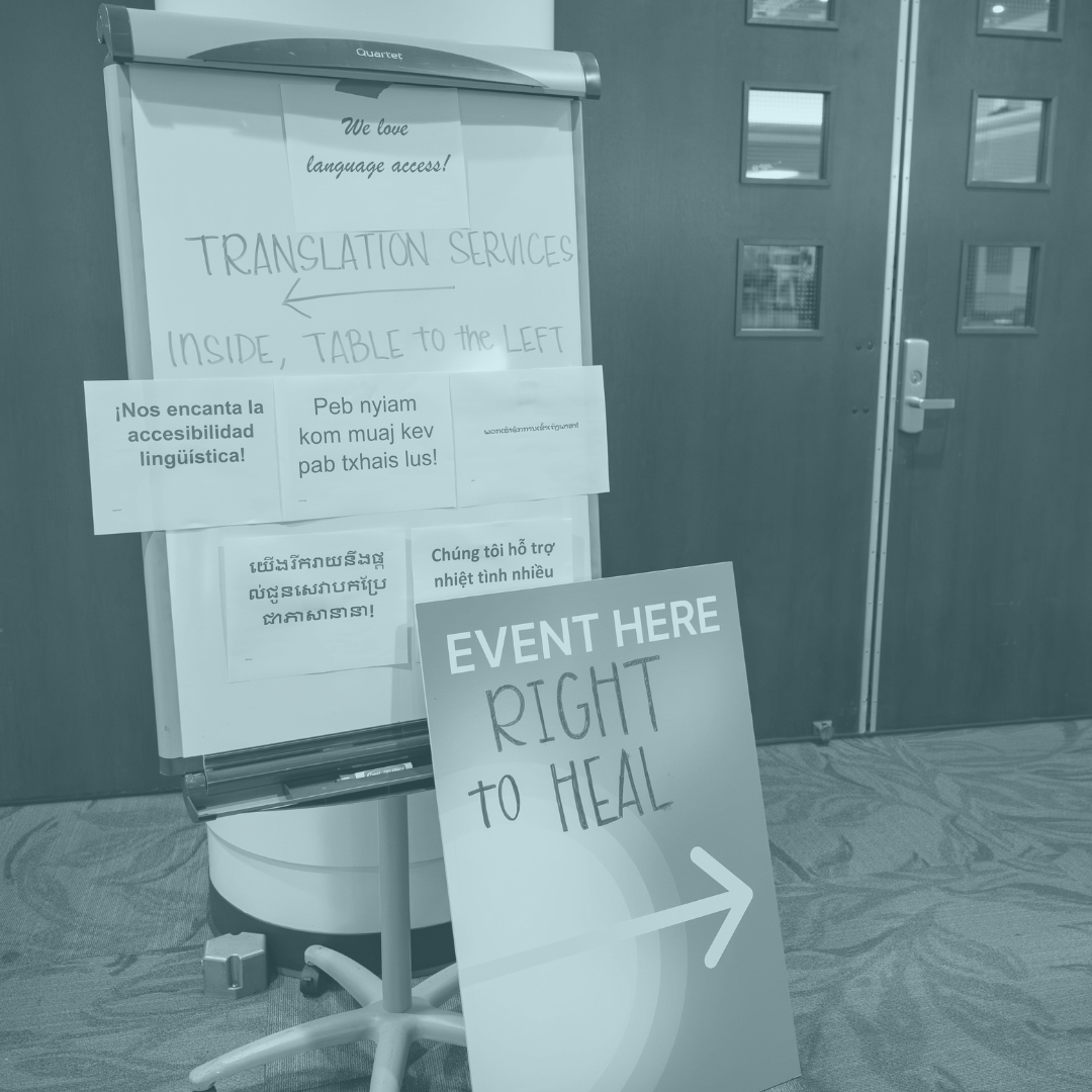 photo of translation services sign in multiple languages at CPEHN event